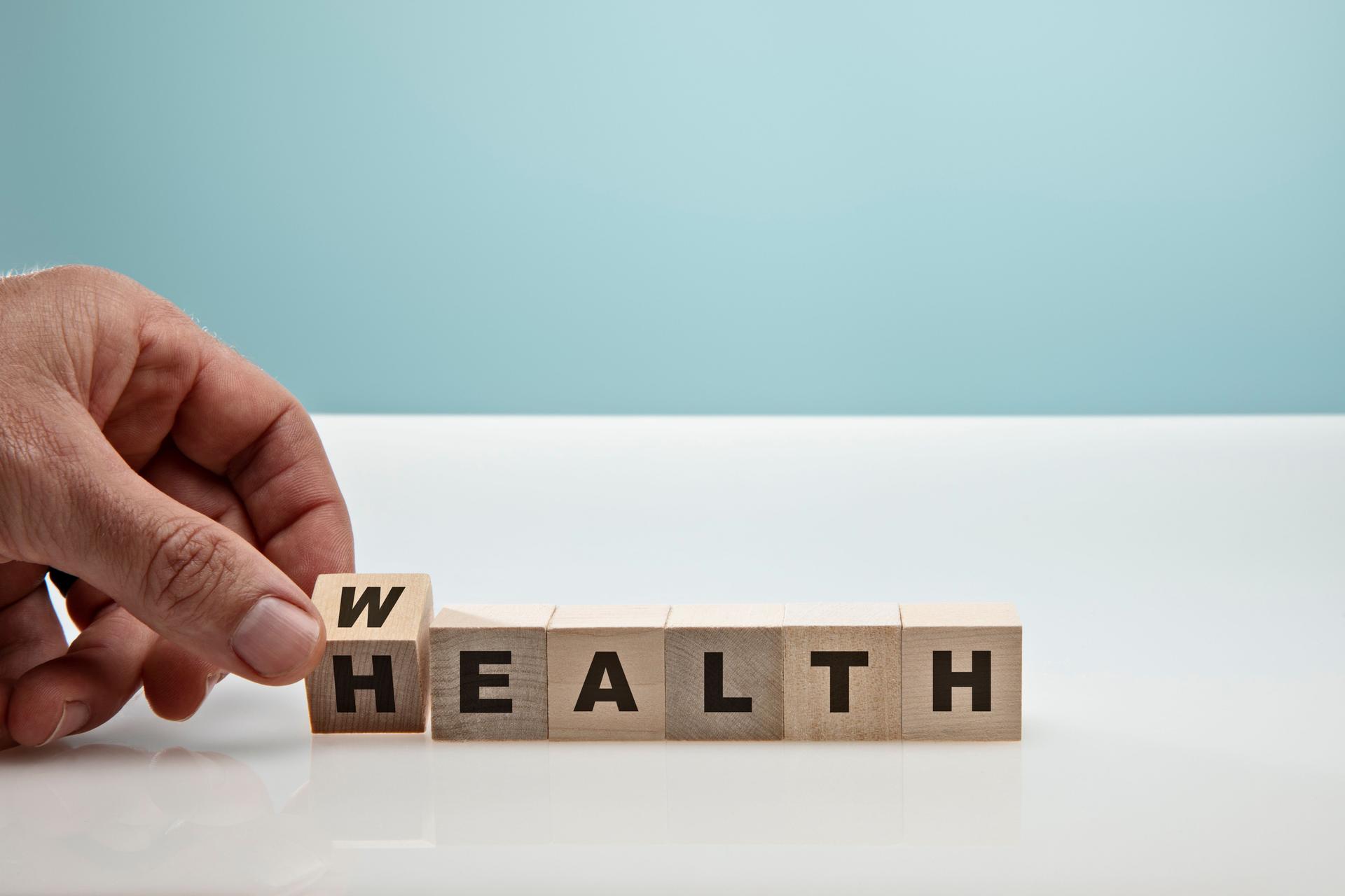 Blocks on Blue Background symbolizing Health Care
