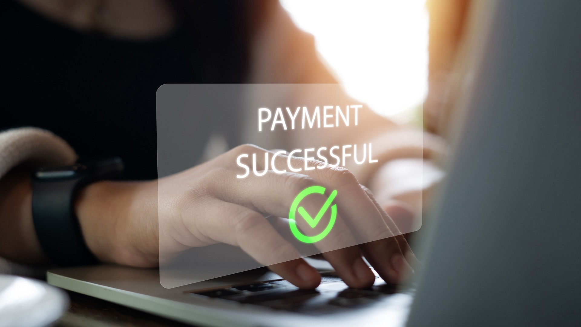 Businesswoman using laptop with successful payment message on screen, online shopping on the internet, purchase invoice